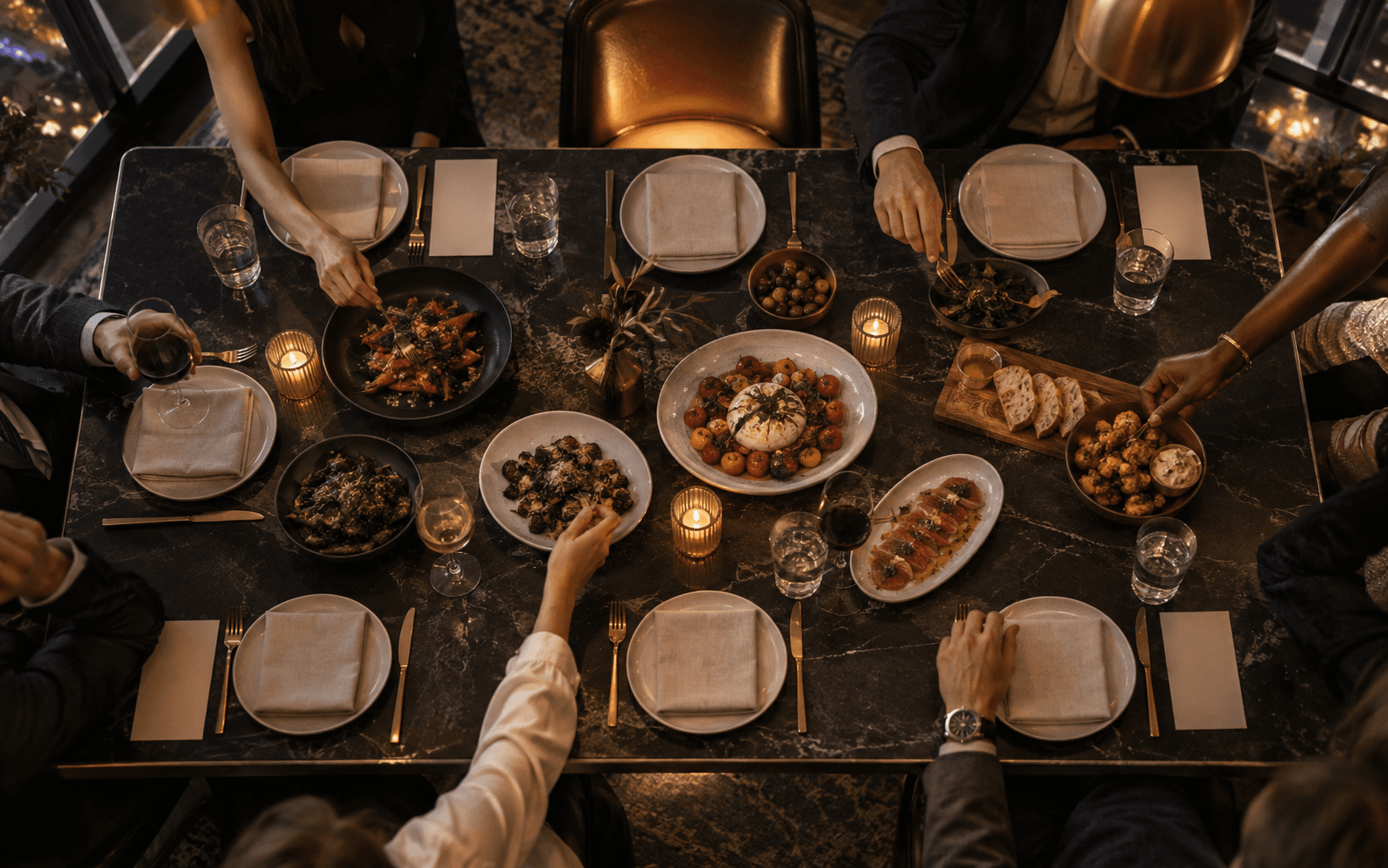 An overhead restaurant table set for an intimate dinner.